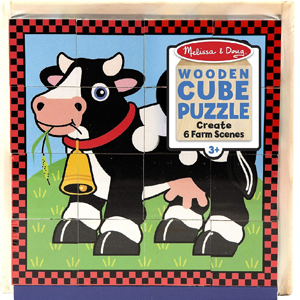 Wooden cube puzzle with a picture of a cow.