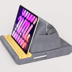 Fabric lap desk with grooves to hold tablet
