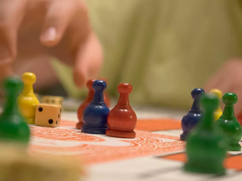 Closeup of board game pieces and dice